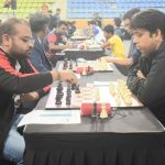 Abhijeet Gupta of PSPB(red and black shirt)(black pieces) making move against Ajay Rai from DASCB(Black shirt)(white pieces) in the 2nd round at Boxing Hall, Shree Shivchhtrapati Krida Sankul Mahalunge Balewadi