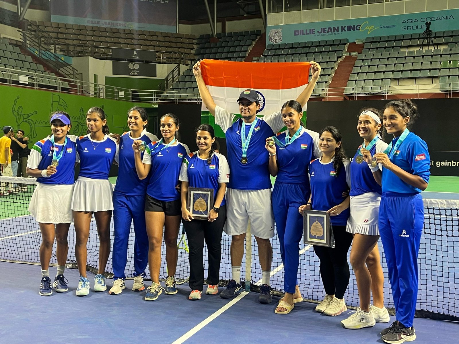 Team India celebrate their qualification to world group playoffs at the Balewadi tennis stadium on Saturday.